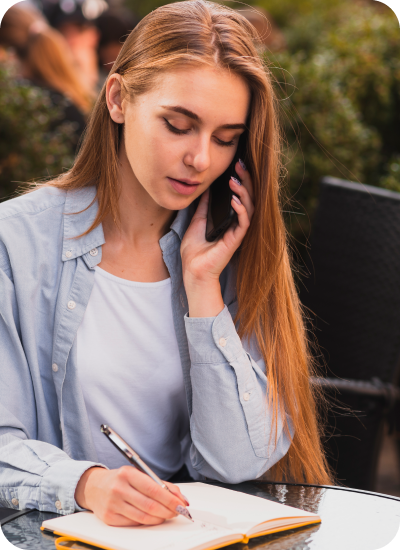 University student writing notes while receiving expert accounting capstone project help and academic guidance in the UK.