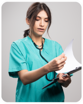 Healthcare student reviewing patient records and clinical documentation for nursing care plan development, SMART goals, and evidence-based practice.