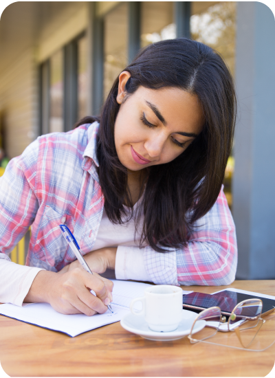 Student analyzing historical sources and writing research notes for a university history capstone project with expert academic guidance.