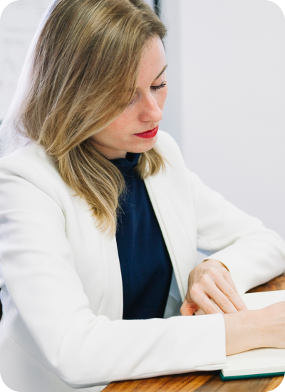 Postgraduate nursing student reviewing healthcare research, evidence synthesis, and project documentation for an MSN academic project.